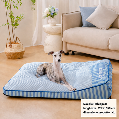 Whippet resting on an XL cooling dog bed