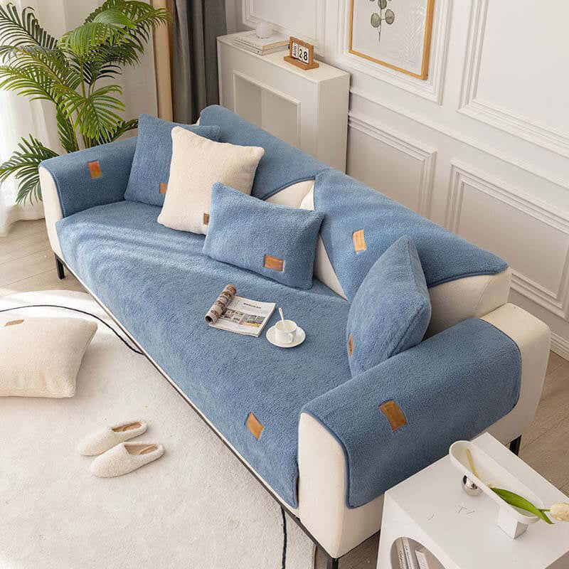Blue sherpa-style cover on a sofa with white cushions