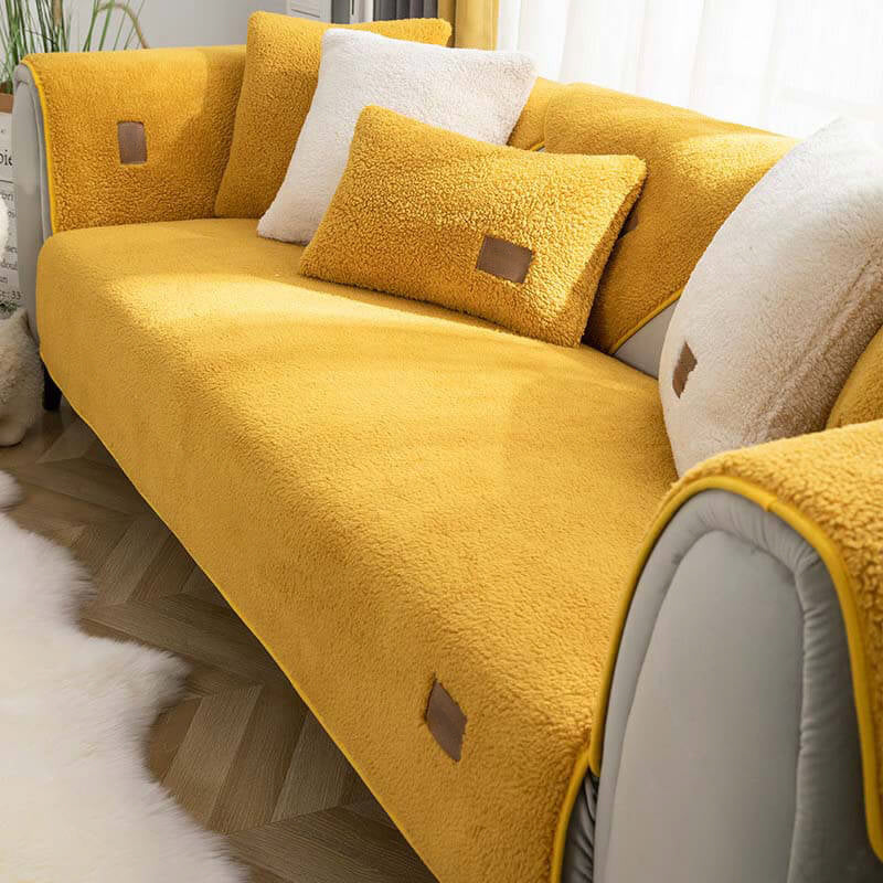 Yellow sherpa-style sofa cover fitted to a sofa