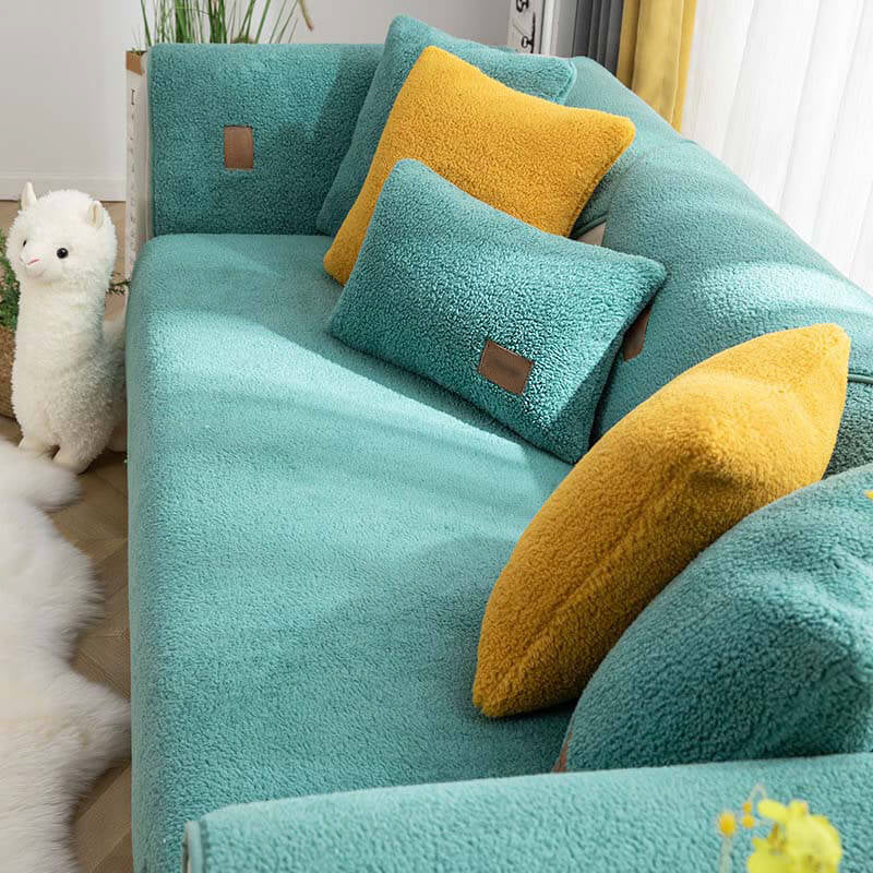 Spa green sherpa-style sofa cover with matching cushions