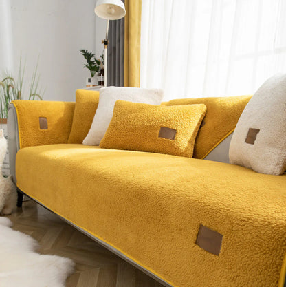 Yellow sherpa-style sofa cover with matching cushions