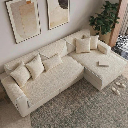 Cream anti-scratch chenille sofa cover on an L-shaped sofa