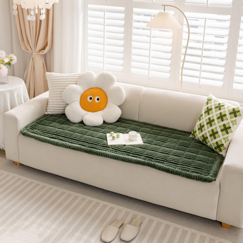 Protective washable flannel mat on a couch